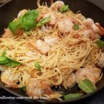 Pasta with shrimps on skillet
